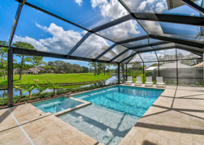 Linear swimming pool in Florida with screened in enclosure